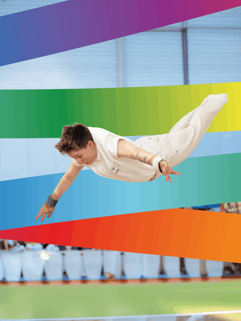 Turnster in vlucht tijdens training. Inclusiviteit in de turnsport: sprong voorwaarts naar acceptatie en diversiteit.